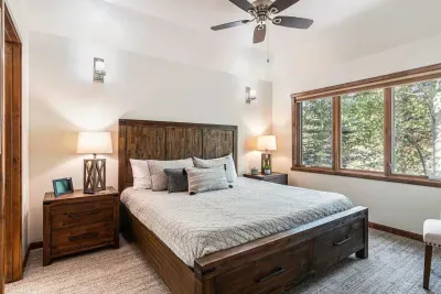 Primary bedroom with king-size bed and ceiling fan