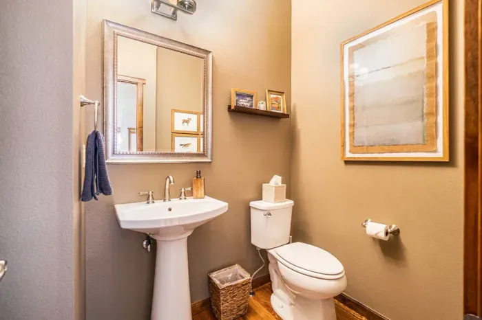 Half bath off the kitchen and living area.