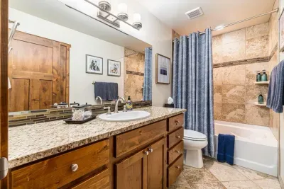 2nd Full bathroom just outside bedrooms 2 & 3.  Tub/Shower combo and granite counter tops.