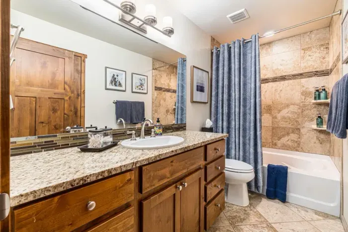 2nd Full bathroom just outside bedrooms 2 & 3.  Tub/Shower combo and granite counter tops.