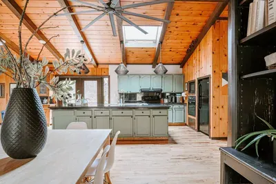 Bright, spacious kitchen with a large island and beautiful wood accents.