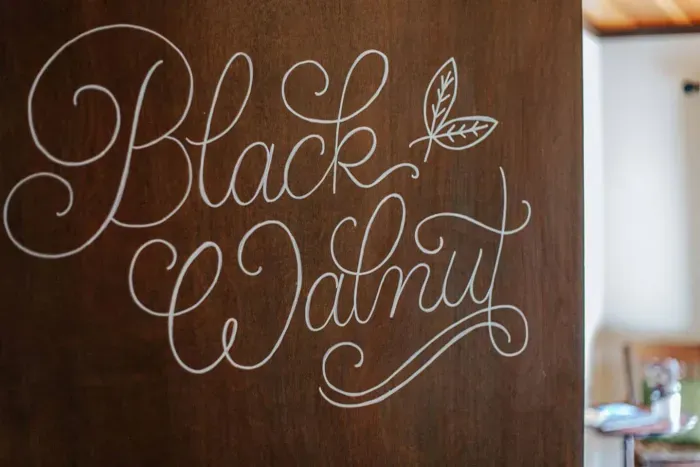 Decorative “Black Walnut” sign adding a personal touch to the space.
