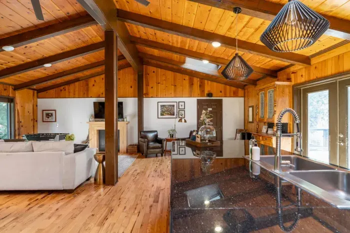 Open-Concept Kitchen & Living Area: Spacious kitchen with a large island, modern appliances, and seamless flow into the cozy living room—perfect for cooking, gathering, and relaxing.