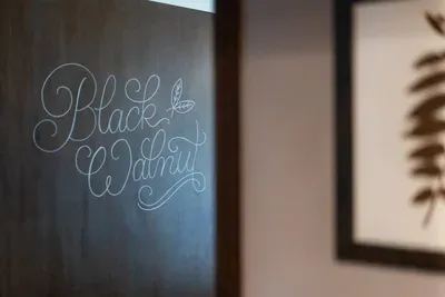 A charming touch of character with the hand-lettered Black Walnut room sign.