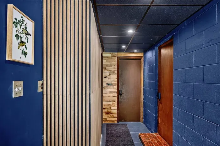 Hallway leading to the Garden Suite rooms, with the door straight ahead providing access to the stairs leading to the Inn.