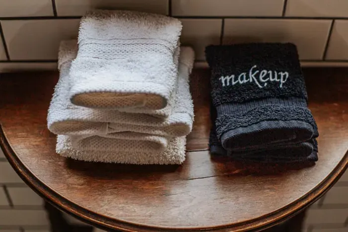 Fresh towels provided for guests, including a dedicated makeup towel.