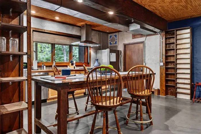 Spacious Garden Suite kitchen and dining area with a large island, seating, and plenty of storage.