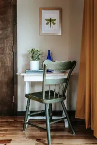 Cozy Workspace: Charming writing desk with a vintage chair, natural accents, and a peaceful, tucked-away feel.