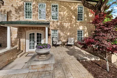 Front door to the Airbnb and seating area. There are a handful of stairs to get down to the property entrance.