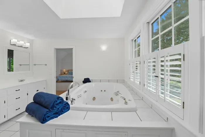 Jetted bathtub in primary ensuite
