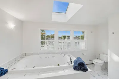 Jetted bathtub in primary ensuite