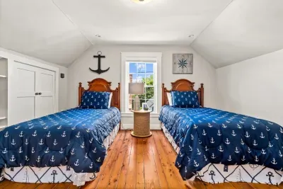 Third floor bedroom. Two twin beds & a dresser.