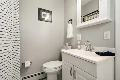 Main floor bathroom. Bathtub with shower. 