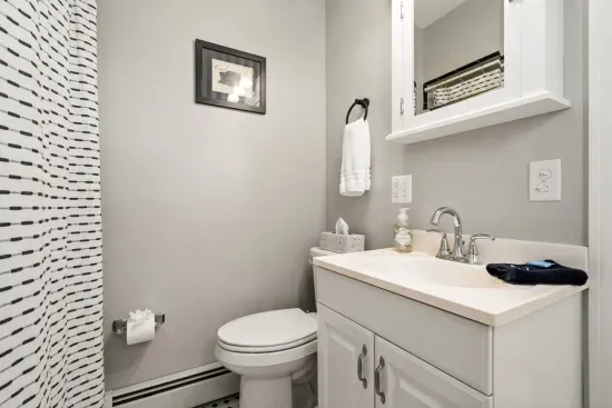 Main floor bathroom. Bathtub with shower.