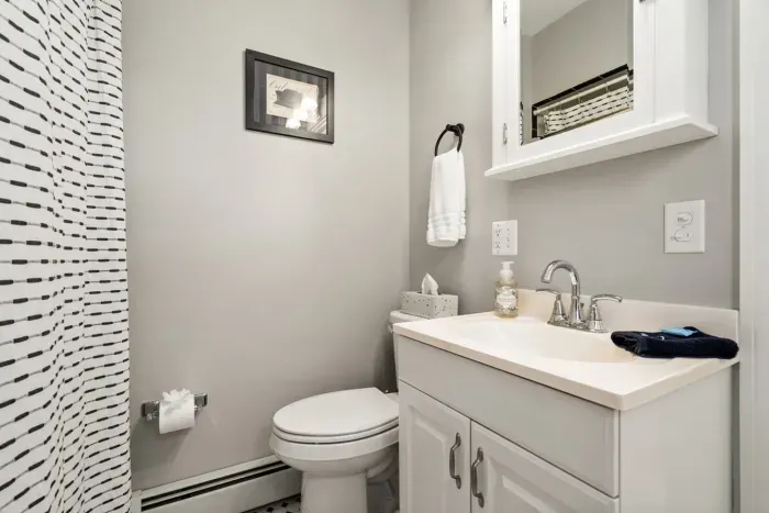 Main floor bathroom. Bathtub with shower.