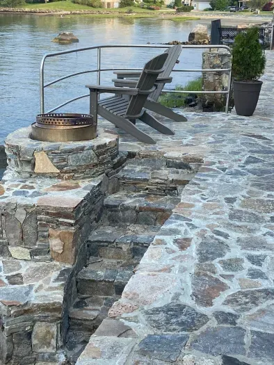 Gorgeous stone walkway with extra seating and fireplace