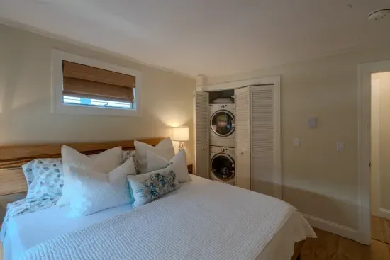 First floor bedroom with a king sized bed. Our guests are welcome to use the washer and dryer.