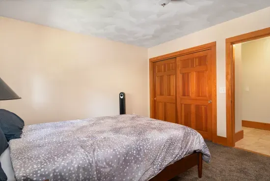 Second bedroom with queen bed and closet for guests to use. For the 5th & 6th guest, there is a blowup mattress in this closet.