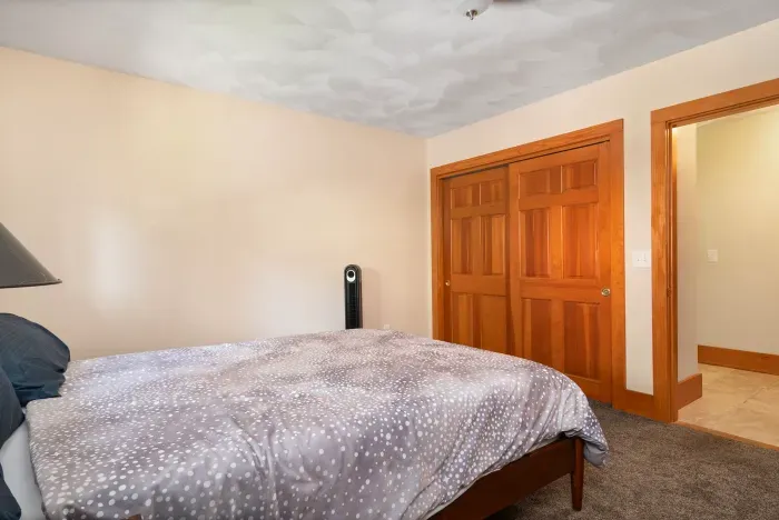 Second bedroom with queen bed and closet for guests to use. For the 5th & 6th guest, there is a blowup mattress in this closet.