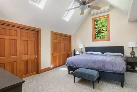 Primary bedroom with king size bed and double closet