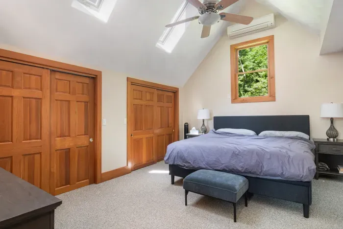 Primary bedroom with king size bed and double closet