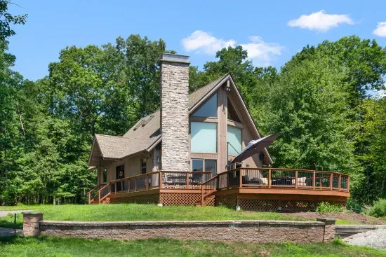 Beautiful deck overlooking large yard and lake.