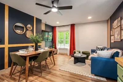 Stylish living and dining space with bold decor and natural light