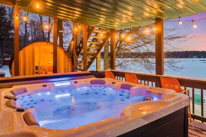 Soak in the lakefront hot tub under twinkling string lights and watch the sunset reflect off the water. Steps away, your private barrel sauna awaits — the perfect Poconos spa-style retreat to unwind, recharge, and feel completely pampered.