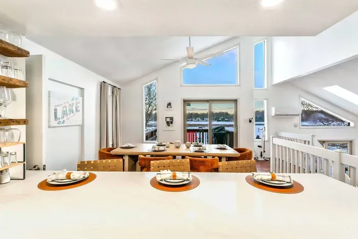 Soaring ceilings and panoramic lake views create the perfect backdrop for every season—from snowy mornings with coffee to golden summer sunsets shared over dinner.