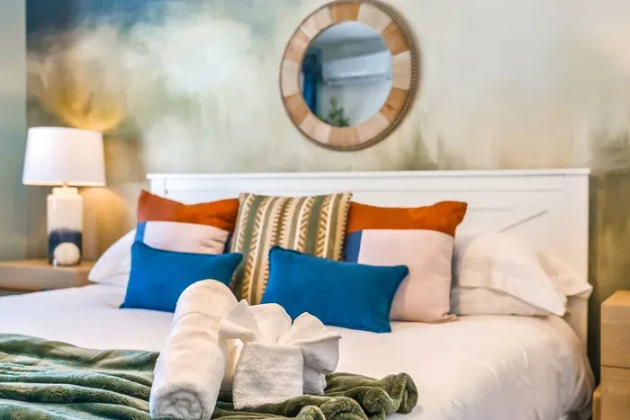 Retreat in comfort with luxe linens, plush pillows, and artful details that make this bedroom feel like a private sanctuary—because rest should feel indulgent.