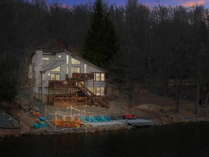 A lakefront dream for the whole family—spacious decks, cozy firepit, and private water access set the scene for unforgettable moments, from s’mores under the stars to sunny days by the shore.