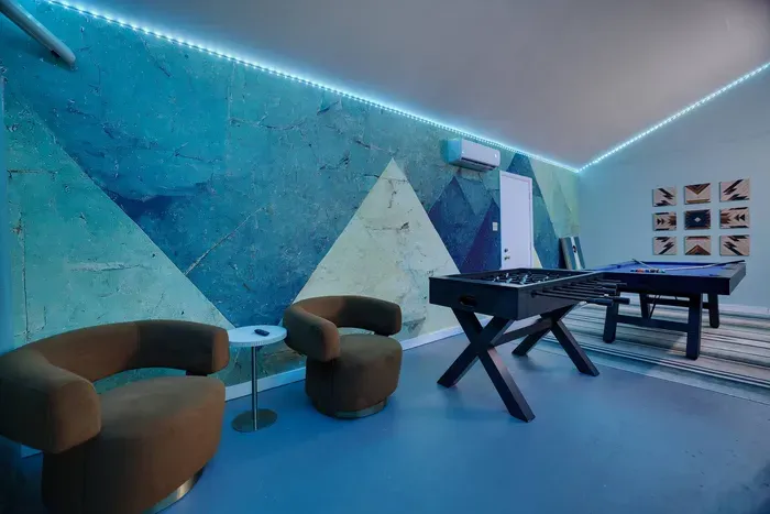 Need a break between games? Kick back in our cozy lounge nook—perfect for sipping a drink, chatting with friends, or just soaking in the vibrant vibes of the game room.