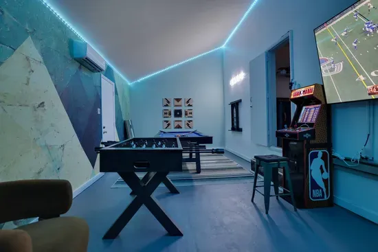 Level up your stay in the private game room featuring Pac-Man and NBA Jam arcades, pool, foosball, and a 75” smart TV. Perfect for movie nights, game days, or family fun — this Poconos lakefront retreat turns every night into playtime.