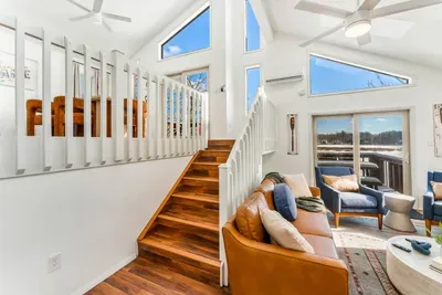 Soaring ceilings, stunning natural light, and modern design details make this space feel open, inviting, and unforgettable—just steps from the loft and full of cozy-chic charm.