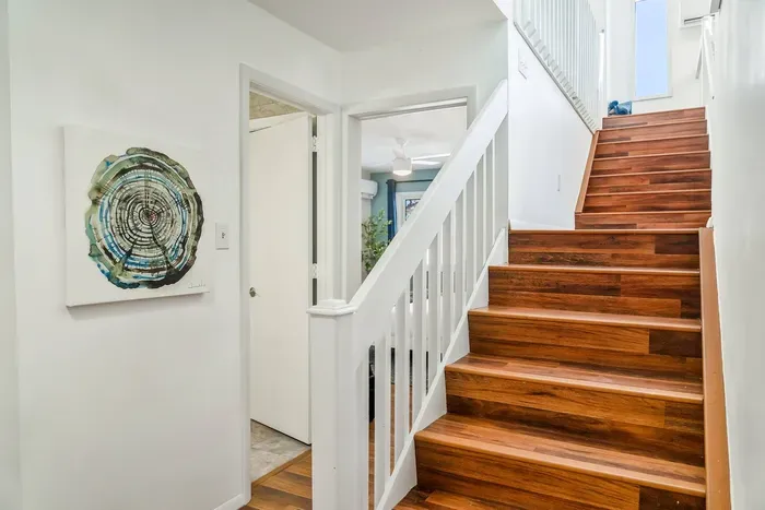 Bright, modern, and beautifully designed—this central stairway connects the heart of the home, with easy flow between bedrooms, living spaces, and private retreats.