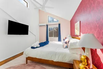 Tucked just off the kitchen on the 2nd floor, this vibrant retreat offers vaulted ceilings, blackout curtains, and a smart TV—ideal for guests who want style, comfort, and easy access to the nearby bunk room.