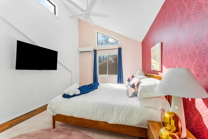 Tucked just off the kitchen on the 2nd floor, this vibrant retreat offers vaulted ceilings, blackout curtains, and a smart TV—ideal for guests who want style, comfort, and easy access to the nearby bunk room.
