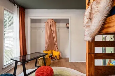 Bright, kid-friendly room with bunk bed and cozy reading nook