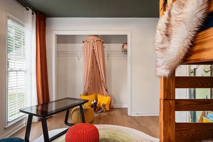 Bright, kid-friendly room with bunk bed and cozy reading nook