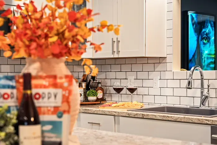 Bright modern kitchen with wine-ready counters and stylish finishes