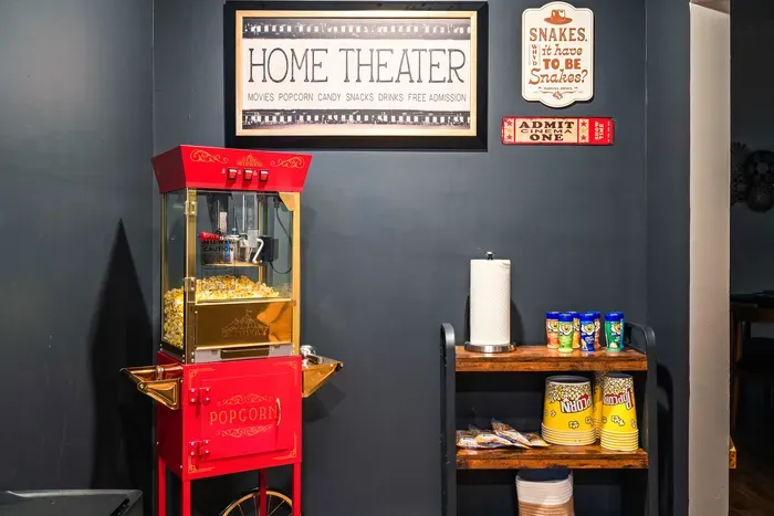 Home theater snack station with popcorn machine for cozy movie nights
