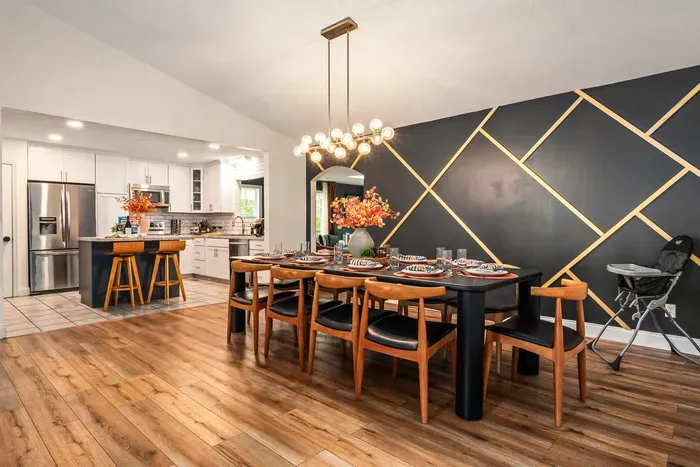 Elegant dining for 8 with designer accent wall and open modern kitchen