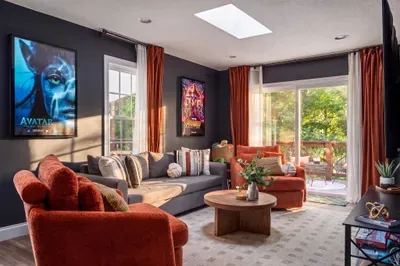 Cozy, light-filled lounge with deck access and bold cinematic style
