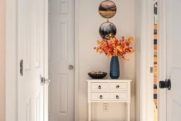 Welcoming hallway with stylish decor and warm seasonal touches