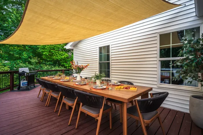 Spacious shaded deck with outdoor dining for memorable group meals