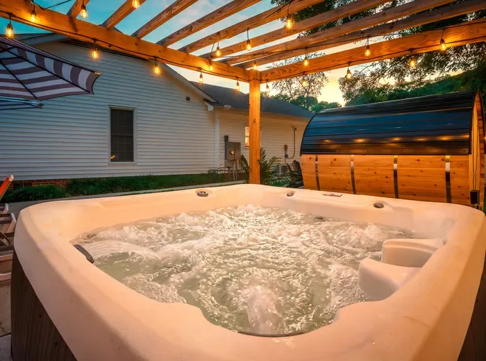 Private hot tub under twinkle lights for the ultimate evening unwind