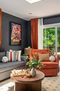 Bright, stylish lounge with cozy seating and peaceful treetop views