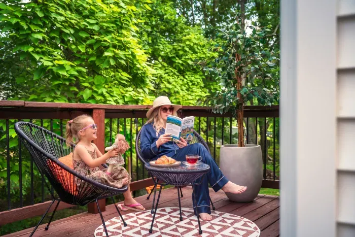 Private wooded deck with cozy seating for relaxing mornings outdoors