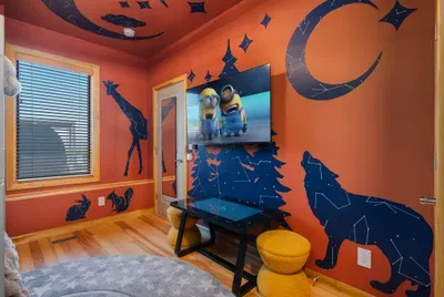 Movie night for the little crew while the grown-ups linger over wine on the deck. Bedtime sorts itself out when the kids have their own room and their own world.