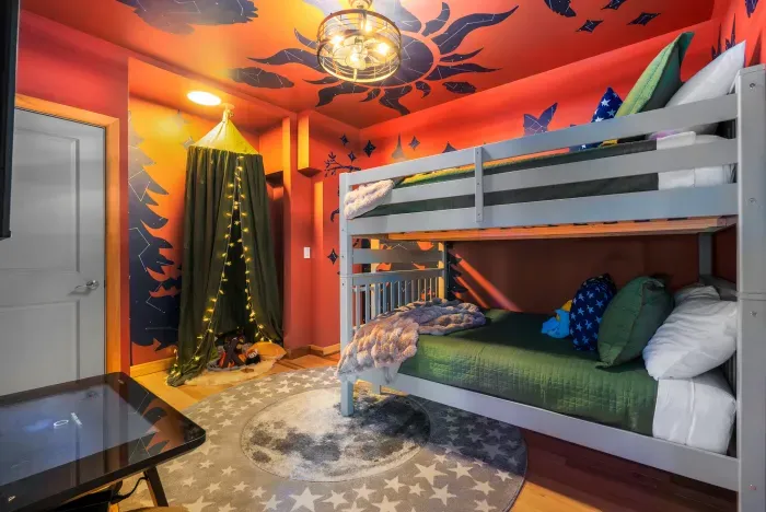 Cousin headquarters. The bunk room becomes basecamp for whispered plans, indoor expeditions, and the kind of sibling memories the parents end up hearing about for years.